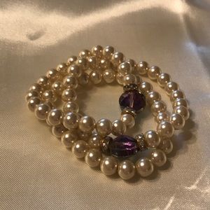 3 stretchy pearl handmade; purple larger bead.
